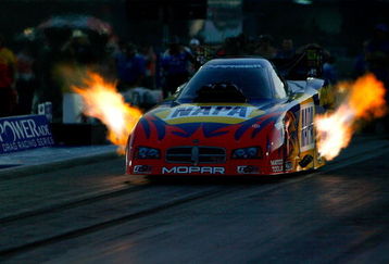 CONCORD, NC - SEPTEMBER 12:  Ron Capps, driver of the NAPA funny car leaves the line during second round qualifying for the NHRA Carolinas Nationals at the Zmax Dragway on September 12, 2008 in Concord, North Carolina.  (Photo by Rusty Jarrett/Getty Images)