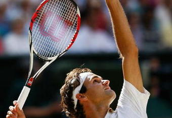 WIMBLEDON, ENGLAND - JULY 05:  Roger Federer of Switzerland serves during the men's singles final match against Andy Roddick of USA on Day Thirteen of the Wimbledon Lawn Tennis Championships at the All England Lawn Tennis and Croquet Club on July 5, 2009 in London, England.  (Photo by Paul Gilham/Getty Images)