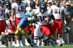 PASADENA, CA - SEPTEMBER 20:  Mike Thomas #10 of the Arizona Wildcats carries the ball for a 14 yard reception past Alterraun Verner #1 of the UCLA Bruins during the college football game at the Rose Bowl on September 20, 2008 in Pasadena, California. The Wildcats defeated the Bruins 31-10.   (Photo by Christian Petersen/Getty Images)