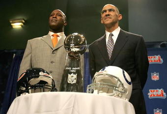 MIAMI - FEBRUARY 02:  (L-R) Head coaches, Lovie Smith of the Chicago Bears and Tony Dungy of the Indianapolis Colts pose together with the Super Bowl Trophy during a press conference at the Miami Beach Convention Center on February 2, 2007 in Miami, Florida.  (Photo by Jonathan Daniel/Getty Images)