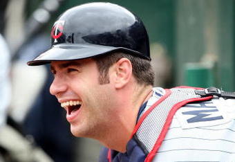 OAKLAND, CA - JUNE 11:  Joe Mauer #7 of the Minnesota Twins looks on against the Oakland Athletics during a Major League Baseball game on June 11, 2009 at the Oakland Coliseum in Oakland, California.  (Photo by Jed Jacobsohn/Getty Images)