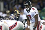6 Jan 2002: Michael Vick #7 of the Atlanta Falcons calls out the play against the St. Louis Rams at the Dome at America's Center in St. Louis, Missouri. The St. Louis Rams beat the Atlanta Falcons 31-13.  DIGITAL IMAGE. Mandatory Credit: Elsa /Getty Images
