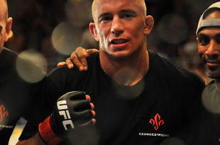 LAS VEGAS - JULY 11:  Georges St. Pierre celebrates his victory against Thiago Alves during their welterweight title bout during UFC 100 on July 11, 2009 in Las Vegas, Nevada. St. Pierre defeated Alves by unanimous decision.  (Photo by Jon Kopaloff/Getty Images)