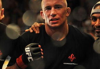 LAS VEGAS - JULY 11:  Georges St. Pierre celebrates his victory against Thiago Alves during their welterweight title bout during UFC 100 on July 11, 2009 in Las Vegas, Nevada. St. Pierre defeated Alves by unanimous decision.  (Photo by Jon Kopaloff/Getty Images)