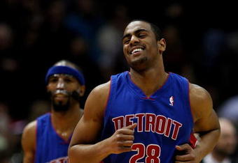 MILWAUKEE - FEBRUARY 07: Arron Afflalo #28 of the Detroit Pistons smiles as he runs upcourt in front of teammate Richard Hamilton #32 during a ganme against the Milwaukee Bucks on February 7, 2009 at the Bradley Center in Milwaukee, Wisconsin. The Pistons defeated the Bucks 126-121 in overtime. NOTE TO USER: User expressly acknowledges and agreees that, by downloading and/or using this Photograph, User is consenting to the terms and conditions of the Getty Images License Agreement. (Photo by Jonathan Daniel/Getty Images)