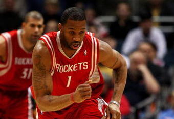 MILWAUKEE - FEBRUARY 09: Tracy McGrady #1 of the Houston Rockets chases down a loose ball against the Milwaukee Bucks on February 9, 2009 at the Bradley Center in Milwaukee, Wisconsin. The Bucks defeated the Rockets 124-112. NOTE TO USER: User expressly acknowledges and agreees that, by downloading and/or using this Photograph, User is consenting to the terms and conditions of the Getty Images License Agreement. (Photo by Jonathan Daniel/Getty Images)