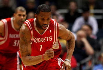 MILWAUKEE - FEBRUARY 09: Tracy McGrady #1 of the Houston Rockets chases down a loose ball against the Milwaukee Bucks on February 9, 2009 at the Bradley Center in Milwaukee, Wisconsin. The Bucks defeated the Rockets 124-112. NOTE TO USER: User expressly acknowledges and agreees that, by downloading and/or using this Photograph, User is consenting to the terms and conditions of the Getty Images License Agreement. (Photo by Jonathan Daniel/Getty Images)