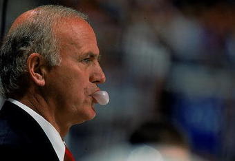 20 Nov 1997: Jacques Lemaire of the New Jersey Devils blows a bubble during the game against the New York Islanders at the Continental Airlines Arena in East Rutherford, New Jersey. The Devils defeated the Islanders 5-1.