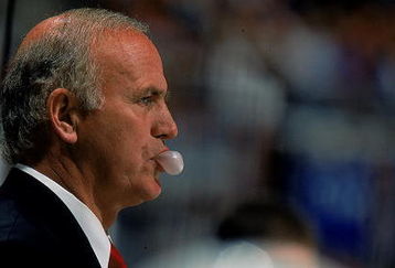 20 Nov 1997: Jacques Lemaire of the New Jersey Devils blows a bubble during the game against the New York Islanders at the Continental Airlines Arena in East Rutherford, New Jersey. The Devils defeated the Islanders 5-1.