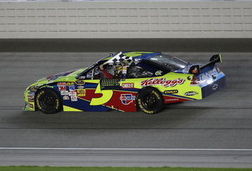 JOLIET, IL - JULY 11:  Mark Martin, driving the #5 CARQUEST/Kellogg's Chevrolet, holds the checkered flag after winning the NASCAR Sprint Cup Series LifeLock.com 400 at Chicagoland Speedway on July 11, 2009 in Joliet, Illinois.  (Photo by Jonathan Daniel/Getty Images)