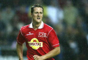 MANNHEIM - JULY 24:  Michael Schumacher of Germany and Ferrari in action during an F1 Allstars charity football match at the Carl-Benz Stadium in Mannheim, Germany. (Photo by: Clive Mason/Getty Images.)
