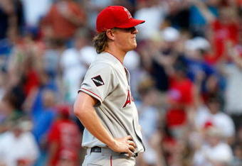 ARLINGTON, TX - JULY 1:  Pitcher Jered Weaver #36 of the Los Angeles Angels of Anaheim reacts after giving up a homerun against Hank Blalock #9 of the Texas Rangers in the fourth inning at Rangers Ballpark July 1, 2009 in Arlington, Texas.  (Photo by Ronald Martinez/Getty Images)
