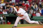 BOSTON - JULY 07:  Josh Beckett #19 of the Boston Red Sox delivers a pitch in the first inning against the Oakland Athletics on July 7, 2009 at Fenway Park in Boston, Massachusetts.  (Photo by Elsa/Getty Images)