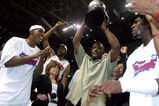 AUBURN HILLS, MI - JUNE 1:  (L-R) Chauncey Billups #1, Rasheed Wallace #30, President of Basketball Operations Joe Dumars (holding trophy) and Ben Wallace #3 of the Detroit Pistons celebrate their win over the Indiana Pacers in Game six of the Eastern Conference Finals during the 2004 NBA Playoffs at The Palace of Auburn Hills on June 1, 2004 in Auburn Hills, Michigan.  The Pistons defeated the Pacers 69-65 and won the 2004 Eastern Conference Championship.  NOTE TO USER: User expressly acknowledges and agrees that, by downloading and/or using this Photograph, user is consenting to the terms and conditions of the Getty Images License Agreement. (Photo by Tom Pidgeon/Getty Images)