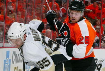 PHILADELPHIA - APRIL 25:  Sergei Gonchar #55 of the Pittsburgh Penguins skates against Claude Giroux #28 of the Philadelphia Flyers during Game Six of the Eastern Conference Quarterfinal Round of the 2009 NHL Stanley Cup Playoffs  at the Wachovia Center on April 25, 2009 in Philadelphia, Pennsylvania. The Penguins defeated the Flyers 5-3 to win the series 4 games to 2.  (Photo by Jim McIsaac/Getty Images)