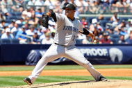 NEW YORK - JULY 06: Ricky Romero #24 of the Toronto Blue Jays pitches against the New York Yankees on July 6, 2009 at Yankee Stadium in the Bronx borough of New York City. (Photo by Jim McIsaac/Getty Images)