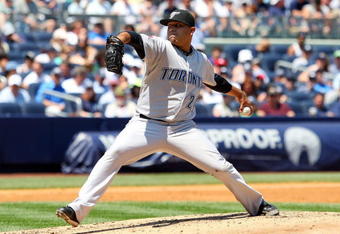 NEW YORK - JULY 06:  Ricky Romero #24 of the Toronto Blue Jays pitches against the New York Yankees on July 6, 2009 at Yankee Stadium in the Bronx borough of New York City.  (Photo by Jim McIsaac/Getty Images)