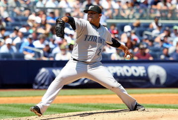 NEW YORK - JULY 06:  Ricky Romero #24 of the Toronto Blue Jays pitches against the New York Yankees on July 6, 2009 at Yankee Stadium in the Bronx borough of New York City.  (Photo by Jim McIsaac/Getty Images)