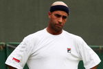 WIMBLEDON, ENGLAND - JUNE 22:  James Blake of USA reacts during the men's singles first round match against Andreas Seppi of Italy on Day One of the Wimbledon Lawn Tennis Championships at the All England Lawn Tennis and Croquet Club on June 22, 2009 in London, England.  (Photo by Hamish Blair/Getty Images)