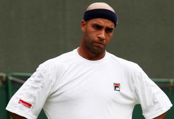WIMBLEDON, ENGLAND - JUNE 22:  James Blake of USA reacts during the men's singles first round match against Andreas Seppi of Italy on Day One of the Wimbledon Lawn Tennis Championships at the All England Lawn Tennis and Croquet Club on June 22, 2009 in London, England.  (Photo by Hamish Blair/Getty Images)