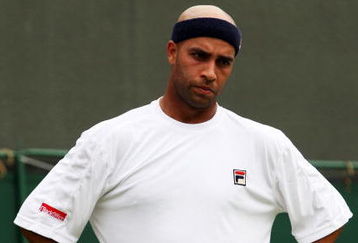 WIMBLEDON, ENGLAND - JUNE 22:  James Blake of USA reacts during the men's singles first round match against Andreas Seppi of Italy on Day One of the Wimbledon Lawn Tennis Championships at the All England Lawn Tennis and Croquet Club on June 22, 2009 in London, England.  (Photo by Hamish Blair/Getty Images)