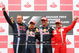 NURBURG, GERMANY - JULY 12: Mark Webber (2nd right) of Australia and Red Bull Racing celebrates with third placed Felipe Massa (right) of Brazil and Ferrari, second placed Sebastian Vettel (2nd left) of Germany and Red Bull Racing and Red Bull Racing Team Manager Jonathan Wheatley on the podium after winning the German Formula One Grand Prix at Nurburgring on July 12, 2009 in Nurburg, Germany. (Photo by Mark Thompson/Getty Images)