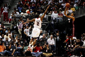 ATLANTA - APRIL 22:  Jamario Moon 38 of the Miami Heat hits a three-pointer as Joe Johnson #2 of the Atlanta Hawks gets a hand up during Game Two of the Eastern Conference Quarterfinals at Philips Arena on April 22, 2009 in Atlanta, Georgia. The Heat defeated the Hawks 108-93. NOTE TO USER: User expressly acknowledges and agrees that, by downloading and/or using this Photograph, user is consenting to the terms and conditions of the Getty Images License Agreement.  (Photo by Doug Benc/Getty Images)