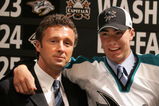 VANCOUVER, BC - JUNE 24:  General manager Doug Wilson (L) of the San Jose Sharks poses with 16th overall pick Ty Wishart of the Sharks on stage during the 2006 NHL Draft held at General Motors Place on June 24, 2006 in Vancouver, Canada.  (Photo by Bruce Bennett/Getty Images)