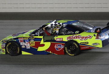 JOLIET, IL - JULY 11:  Mark Martin, driving the #5 CARQUEST/Kellogg's Chevrolet, holds the checkered flag after winning the NASCAR Sprint Cup Series LifeLock.com 400 at Chicagoland Speedway on July 11, 2009 in Joliet, Illinois.  (Photo by Jonathan Daniel/Getty Images)