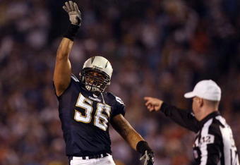 SAN DIEGO - DECEMBER 24:  Linebacker Shawne Merriman #56 of the San Diego Chargers celebrates his recovery of Quarterback Jay Cutler's #6 of the Denver Broncos fumble of the ball from the pressure of Luis Castillo #93 of the Chargers during the first half of their NFL game at Qualcomm Stadium December 24, 2007 in San Diego, California.  (Photo by Donald Miralle/Getty Images)
