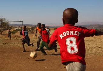 NATAL, SOUTH AFRICA - JULY 03:  Local children play football in a Zulu village on July 3, 2009 near to Rorke's Drift in Natal, South Africa. (Photo by Alex Livesey/Getty Images)