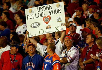 MIAMI - JANUARY 08:  A fan holds up a sign in reference to an ongoing rumor that the Notre Dame Fighting Irish have been interested in hiring Urban Meyer, head coach of the Florida Gators, during the FedEx BCS National Championship game against the Oklahoma Sooners at Dolphin Stadium on January 8, 2009 in Miami, Florida.  (Photo by Marc Serota/Getty Images)