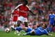 LONDON - MAY 10:  Emmanuel Adebayor of Arsenal is tackled by Branislav Ivanovic of Chelsea during the Barclays Premier League match between Arsenal and Chelsea at the Emirates Stadium on May 10, 2009 in London, England.  (Photo by Jamie McDonald/Getty Images)