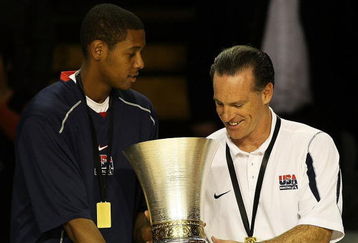 AUCKLAND, NEW ZEALAND - JULY 12: Howard Thompkins of the United States passes the trophy over to head coach Jamie Dixon after winning the U19 Basketball World Championships Final match between Greece and the United States of America at North Shore Events Centre on July 12, 2009 in Auckland, New Zealand.  (Photo by Hannah Johnston/Getty Images)