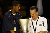 AUCKLAND, NEW ZEALAND - JULY 12: Howard Thompkins of the United States passes the trophy over to head coach Jamie Dixon after winning the U19 Basketball World Championships Final match between Greece and the United States of America at North Shore Events Centre on July 12, 2009 in Auckland, New Zealand.  (Photo by Hannah Johnston/Getty Images)