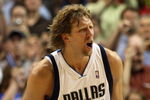 DALLAS - MAY 11:  Forward Dirk Nowitzki #41 of the Dallas Mavericks reacts after making a shot against the Denver Nuggets in Game Four of the Western Conference Semifinals during the 2009 NBA Playoffs at American Airlines Center on May 11, 2009 in Dallas, Texas. NOTE TO USER: User expressly acknowledges and agrees that, by downloading and or using this photograph, User is consenting to the terms and conditions of the Getty Images License Agreement.  (Photo by Ronald Martinez/Getty Images)
