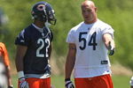 LAKE FOREST, IL - MAY 20: Brian Urlacher #54 of the Chicago Bears talks with teammate Matt Forte #22 during an organized team activity (OTA) practice on May 20, 2009 at Halas Hall in Lake Forest, Illinois.  (Photo by Jonathan Daniel/Getty Images)