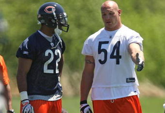 LAKE FOREST, IL - MAY 20: Brian Urlacher #54 of the Chicago Bears talks with teammate Matt Forte #22 during an organized team activity (OTA) practice on May 20, 2009 at Halas Hall in Lake Forest, Illinois.  (Photo by Jonathan Daniel/Getty Images)