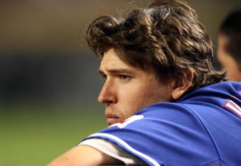 PHOENIX - JUNE 23:  Ian Kinsler #5 of the Texas Rangers looks on from the dugout during the major league baseball game against the Arizona Diamondbacks at Chase Field on June 23, 2009 in Phoenix, Arizona. The Diamondbacks defeated the Rangers 8-2.  (Photo by Christian Petersen/Getty Images)
