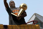 LOS ANGELES, CA - JUNE 17:  Kobe Bryant #24 holds the Larry O'Brien trophy and waves to the crowd from the top of a double decker bus at the start of the Los Angeles Lakers NBA championship victory parade outside the Staples Center on June 17, 2009 in Los Angeles, California.  (Photo by Stephen Dunn/Getty Images)
