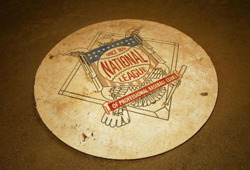 HOUSTON - MAY 25:  The National League Baseball logo on the field behind the plate during the game between the Chicago Cubs and the Houston Astros at Minute Maid Park on May 25, 2004 in Houston, Texas. The Astros won 5-0. (Photo by Ronald Martinez/Getty Images)
