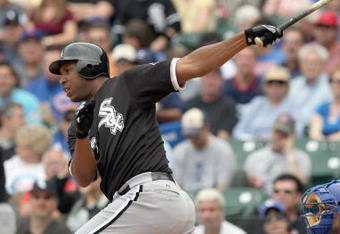 CHICAGO - JUNE 17: Jermaine Dye #23 of the Chicago White Sox makes a hit against the Chicago Cubs on June 17, 2009 at Wrigley Field in Chicago, Illinois. (Photo by Jonathan Daniel/Getty Images)