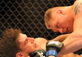 LAS VEGAS - JULY 11:  Brock Lesnar holds down Frank Mir during their heavyweight title bout during UFC 100 on July 11, 2009 in Las Vegas, Nevada.  (Photo by Jon Kopaloff/Getty Images)