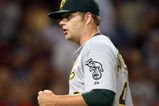 BOSTON - JULY 06:  Starting pitcher Brett Anderson #49 of the Oakland Athletics celebrates his shutout against the Boston Red Sox on July 6, 2009 at Fenway Park in Boston, Massachusetts. The Athletics defeated the Red Sox 6-0. (Photo by Elsa/Getty Images)