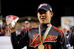 LOS ANGELES, CA - MARCH 23:  Daisuke Matsuzaka #18 of Japan holds up the the MVP trophy after defeating Korea during the finals of the 2009 World Baseball Classic on March 23, 2009 at Dodger Stadium in Los Angeles, California. Japan won 5-3 in 10 innings.  (Photo by Kevork Djansezian/Getty Images)