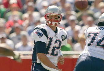 FOXBORO, MA - SEPTEMBER 7:  Quarterback Tom Brady #12 of the New England Patriots passes the ball up the middle during their NFL game against the Kansas City Chiefs on September 7, 2008 at Gillette Stadium in Foxboro, Massachusetts. The Patriots defeated the Chiefs 17-10. (Photo by Elsa Garrison/Getty Images)