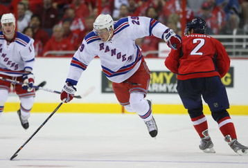 WASHINGTON - APRIL 18:  Lauri Korpikoski #29 of the New York Rangers skates past Brian Pothier #2 of the Washington Capitals during Game Two of the Eastern Conference Quarterfinal Round of the 2009 NHL Stanley Cup Playoffs at Verizon Center on April 18, 2009 in Washington, DC.  (Photo by Bruce Bennett/Getty Images)