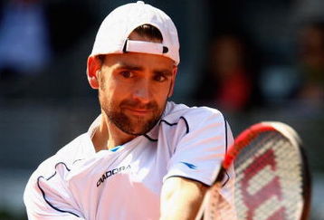MADRID, SPAIN - MAY 10:  Nicolas Kiefer of Germany plays a backhand against Tommy Robredo of Spain in their first round match during the Madrid Open tennis tournament at the Caja Magica on May 10, 2009 in Madrid, Spain.  (Photo by Clive Brunskill/Getty Images)