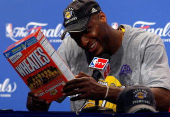 ORLANDO, FL - JUNE 14:  Lamar Odom #7 of the Los Angeles Lakers looks at the Wheaties box during the post game news conference after the Lakers defeated the Orlando Magic 99-86 to win the NBA Championship in Game Five of the 2009 NBA Finals on June 14, 2009 at Amway Arena in Orlando, Florida.  NOTE TO USER:  User expressly acknowledges and agrees that, by downloading and or using this photograph, User is consenting to the terms and conditions of the Getty Images License Agreement.  (Photo by Chris Graythen/Getty Images)
