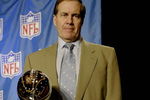 HOUSTON - JANUARY 30:  New England Patriots head coach Bill Belichick poses with the Vince Lombardi trophy after a press conference on January 30, 2004 at the Hilton Hotel in Houston, Texas. (Photo by Jeff Gross/Getty Images)